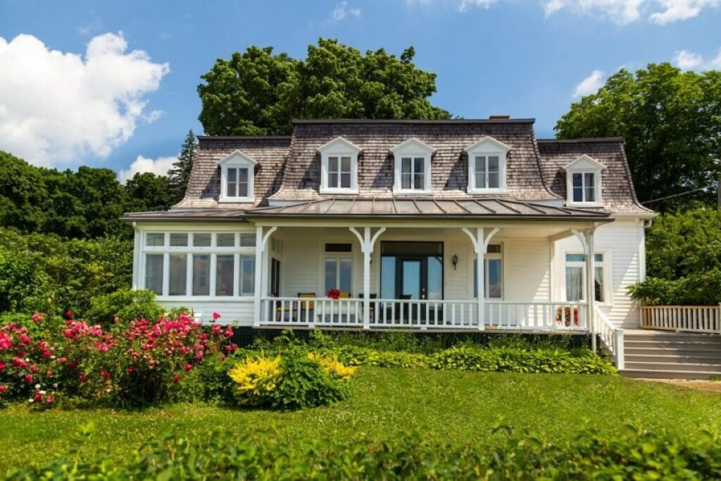 mansard roof beautiful white house colonial style surrounded by nature