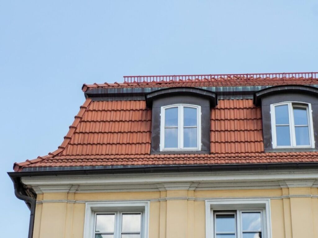 mansard roof old colonial style house orange ceramic tiles