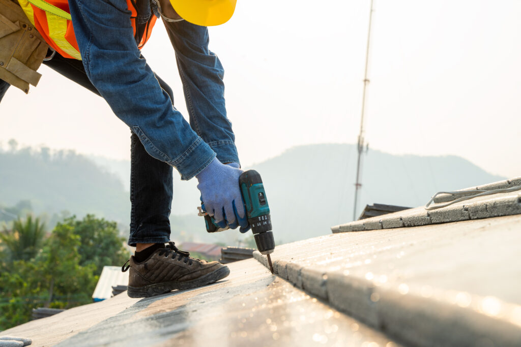 Construction worker installing the new roof