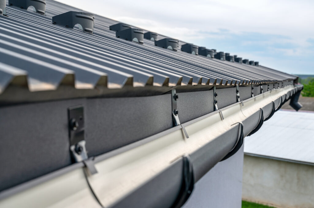 Gutter system for a metal roof