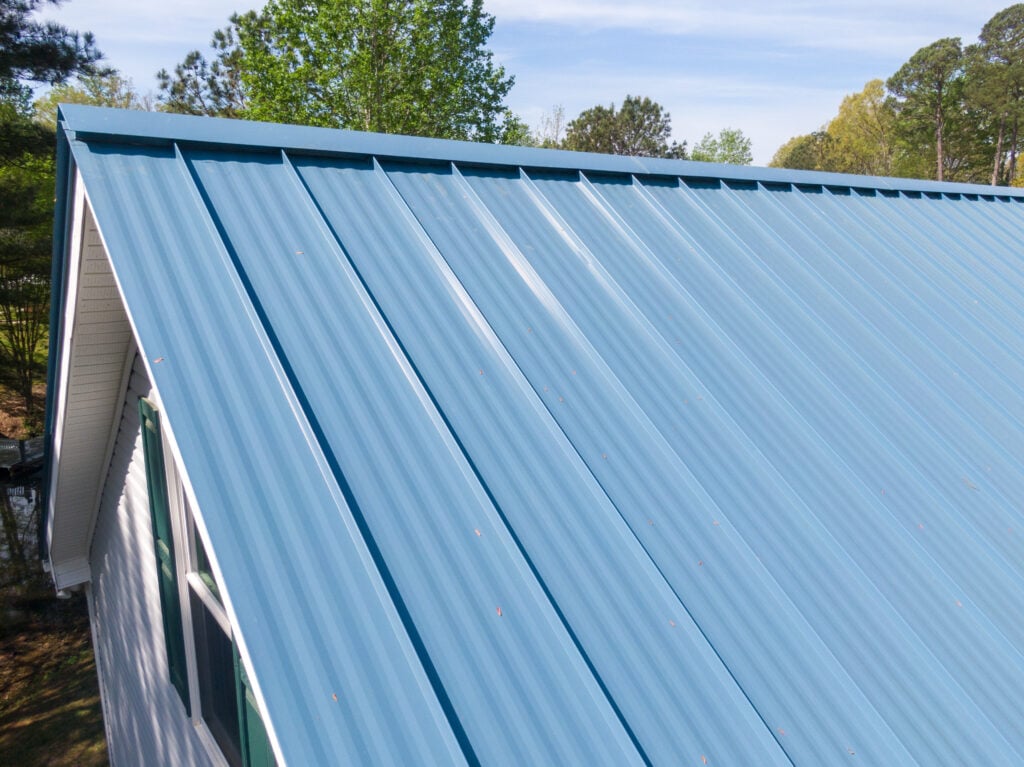 Metal roof on a single family home featuring 5V style panels.