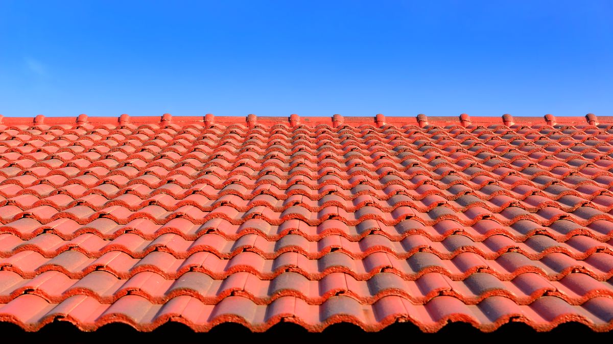 brava roof tile ceramic orange tiles closeup blue sky summer time