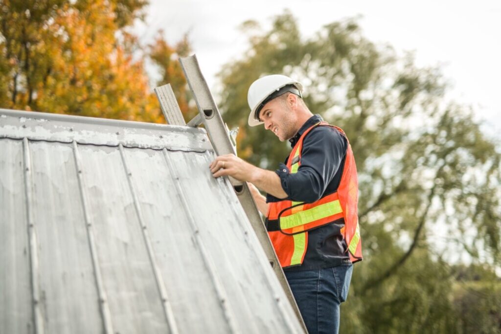 Worker inspecting a roof