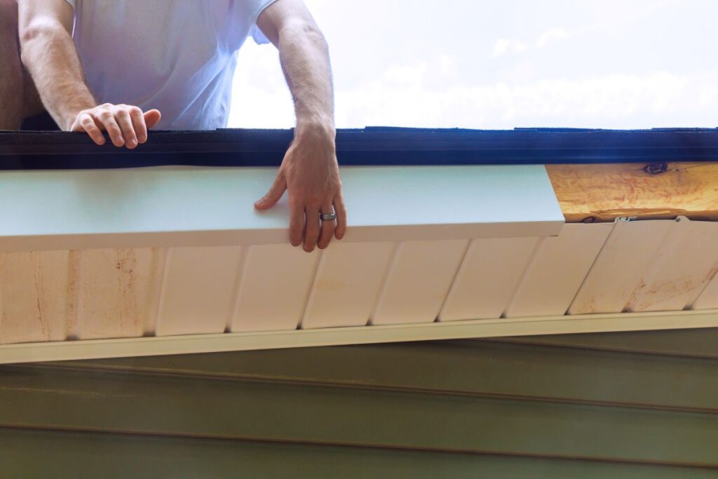 what is fascia on a house worker repairing white fascia wood and metal roof