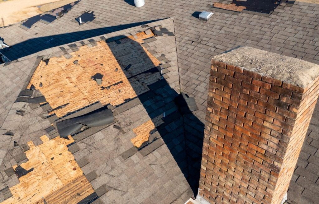 wind damage to roof shingles roof falling after wind storm brick chimney big family house
