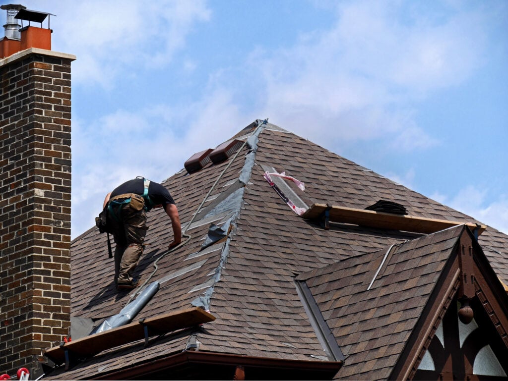 roof repair on brown house