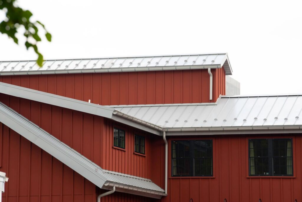 metal roof and siding color combinations orange house black windows