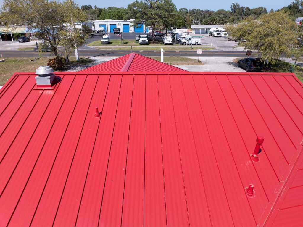 roofing clearwater fl red metallic roof Florida Bros Project sunny day