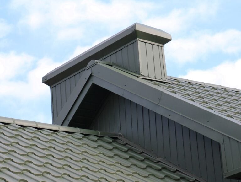 standing seam vs exposed fastener green metallic roof big house tiles